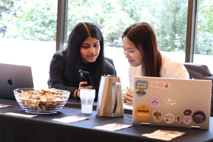 Sunny and a colleague collaborating at a table